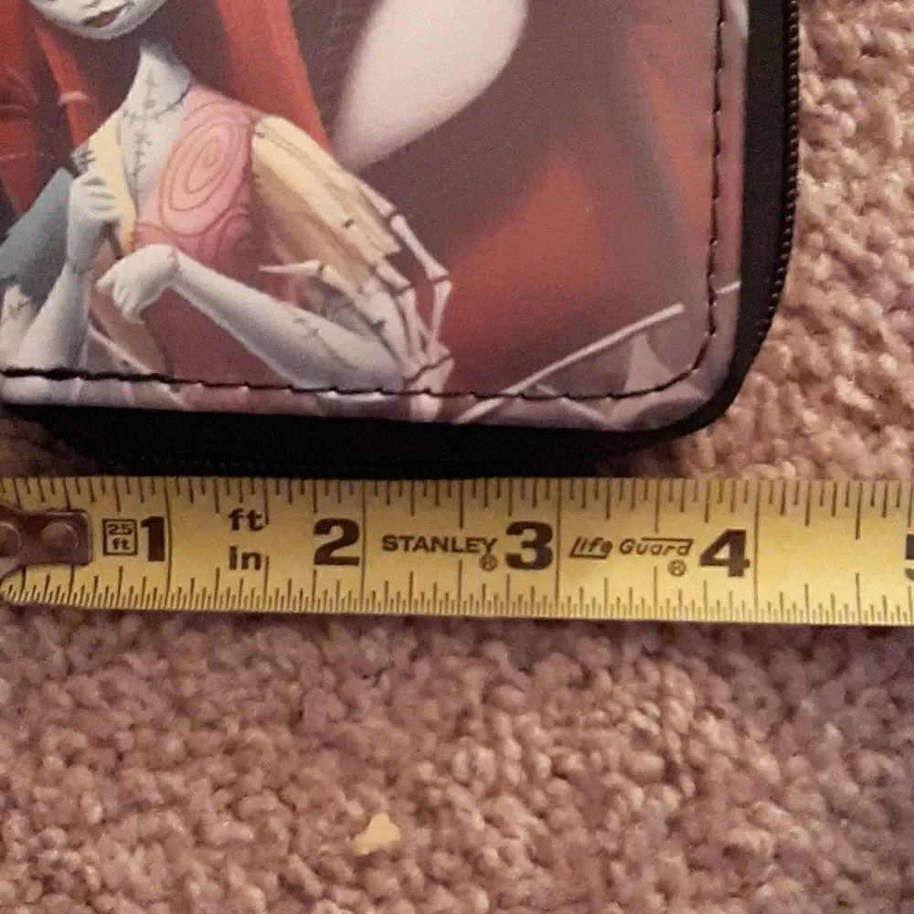 NWOT  Nightmare Before Christmas short wallet with zippered closure.